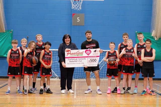 Proudfoot Director Valerie Aston presents Scarborough Seahawks with a cheque for £500