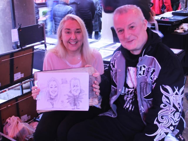Hilary and Dave from Chester get their portraits drawn.
picture: Sienna French.