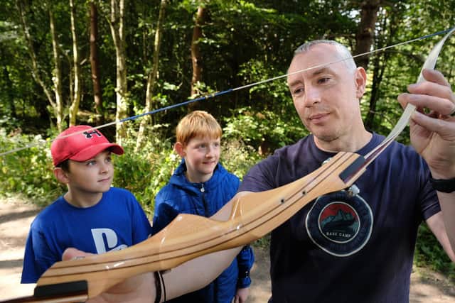 Ready for archery Jacob and Bowen,with instructor Dan Morris. Photo: Richard Ponter