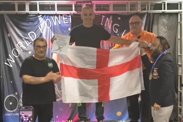 John Benson, centre, holding a St George’s flag, won a gold medal at the World Powerlifting Union World Championships