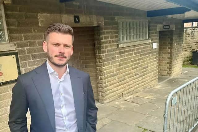 Cllr Keane Duncan outside Malton Market Place toilets.