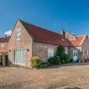 The attractive exterior of the village property.