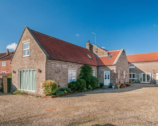 The attractive exterior of the village property.