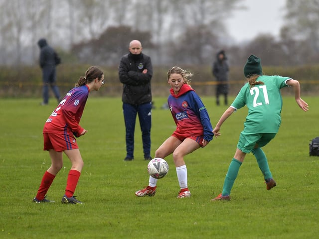 Scarborough Ladies Under-15s' Ruby Carney, centre, and team-mate Mollie Morrison