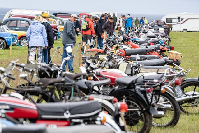 Visitors view the vintage motorcycles