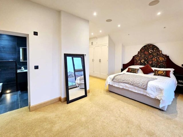 One of four first floor bedrooms with en suite facilities.