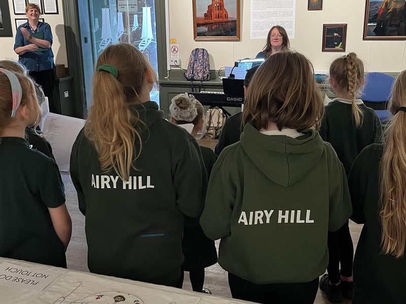 Airy Hill School choir, with music teacher Jill Mortimer.