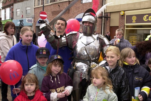 Sir Idduno with children in Doncaster Market Place for the National Spring Clean
