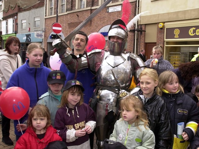 Sir Idduno with children in Doncaster Market Place for the National Spring Clean