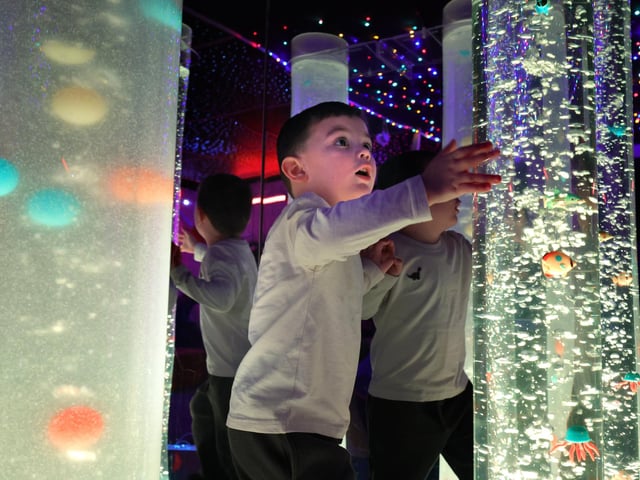 Edward plays in the sensory room
