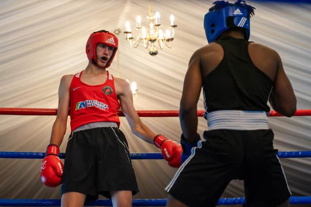 Scarborough's Harry Sheader, red vest, in action. Photo by Wandering Photography