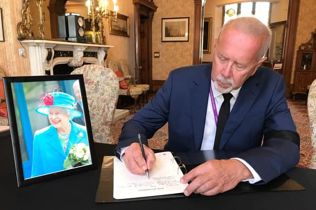 Councillor Steve Siddons signs the Book of Condolence in Scarborough Town Hall