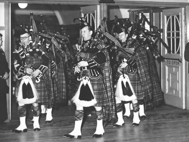 Bagpipe playing, possibly at the Grand Hotel. (year unknown)