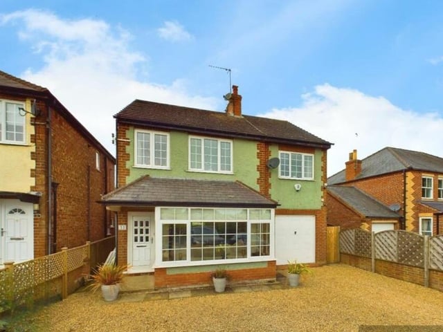 A front view of the property, that has a spacious, open plan interior.