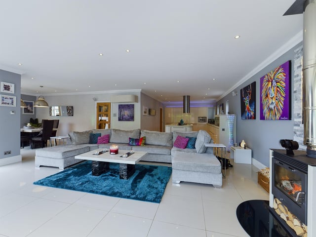 This comfortable family seating area links to the kitchen and dining space on the ground floor.