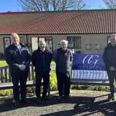 Nick Jones (far left), Chairman of Scarborough Flower Fund Homes with representatives from CG Building and Restoration Ltd