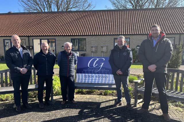 Nick Jones (far left), Chairman of Scarborough Flower Fund Homes with representatives from CG Building and Restoration Ltd