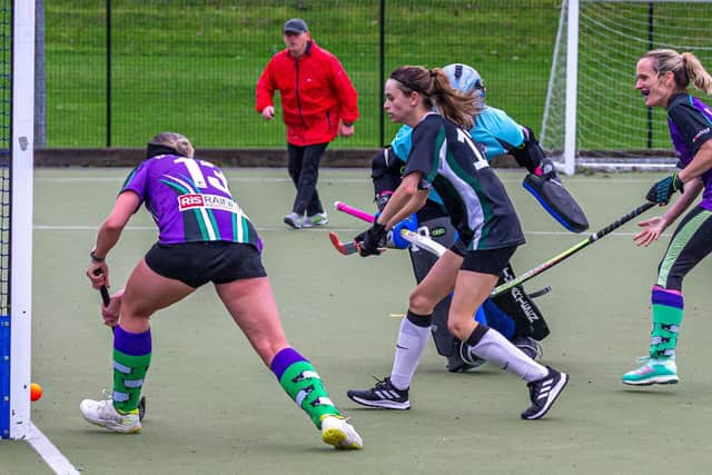 Laura Anderson Cornforth, far right, scores for Danby.