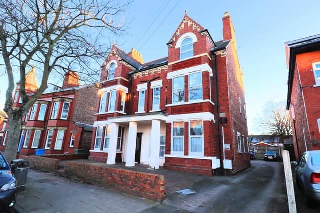A ground floor apartment in this Victorian building is currently for sale.
