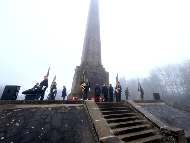 The standard bearers surround the monument