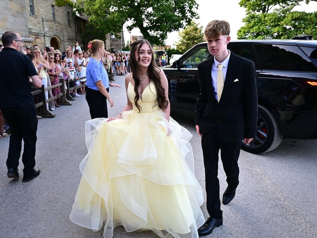 A good crowd watched students arrive for their big night.