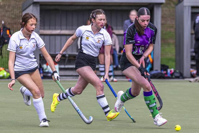 Chloe Walker races away from a couple of Pickering players. Photo by Brian Murfield