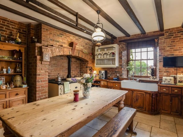 The beamed, bespoke Albert Thundercliffe kitchen has a five-door Aga among its appliances.