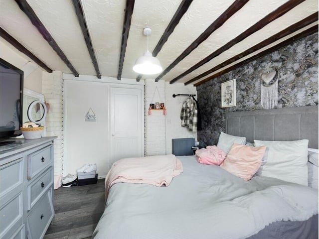 Another double bedroom, with ceiling beams.