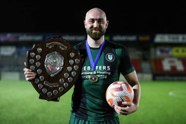 Hat-trick hero Brendan Wilson-McGarry poses with the match-ball and the silverware.   PHOTOS BY ZACH FORSTER