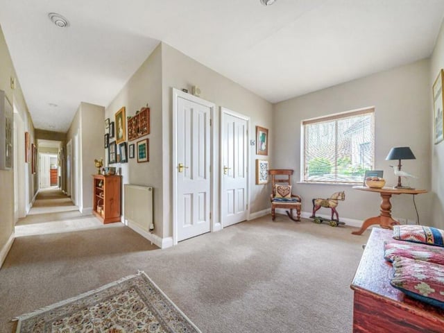 The spacious first floor landing has room for seating, study or reading space.
