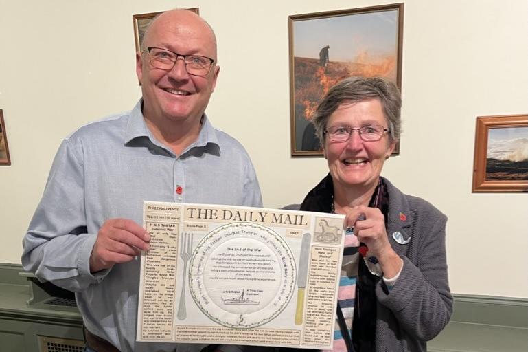 County Coun Phil Trumper and embroiderer Carole Sinclair.