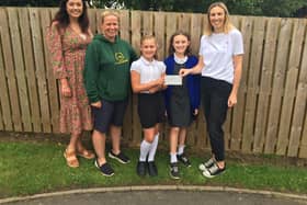 Camarah Mosey, Headteacher, Helen Wilford, Chair of Thornton Dale Primary PTA, students from Thornton Dale Primary School, and Lorna Mann, Pavers