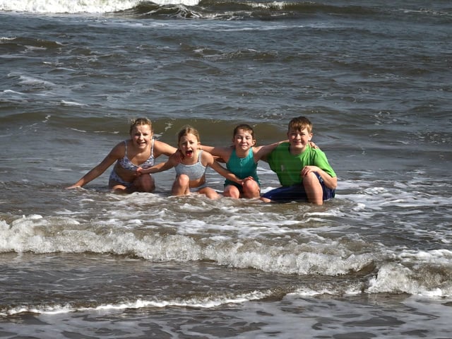 Playing in the chilly spring tide.
