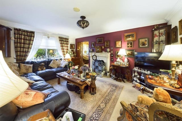 The lounge has a gas fire with marble effect surround, and looks over the garden.