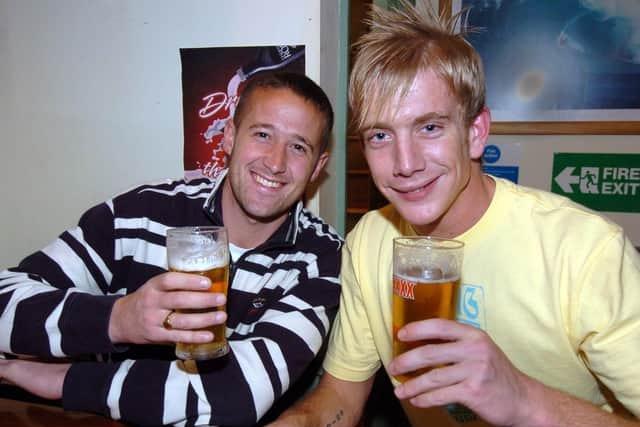 Paul from Bradford visiting his friend John from town, catching up over a pint