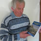 Former Eskdale School Head Dave Bradley with a copy of his first novel, William Bradley's Handcart.