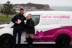 Saint Cecilia’s Care Group Director Aaron Padgham and Steph Harbron, Deputy Manager at Saint Cecilia’s Care Group, with some of the shopping vouchers and the recruitment message vehicles.