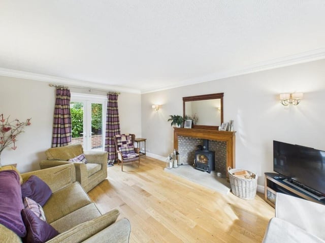 A cosy sitting room with French doors to outside.