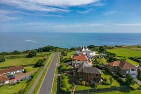 An overview of the property in its stunning location with sea views.