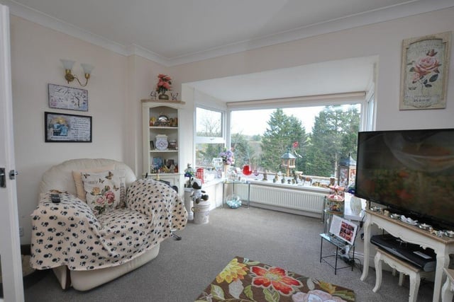 A large picture window lights up the lounge.