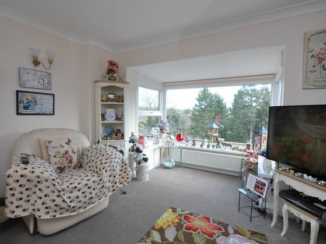 A large picture window lights up the lounge.