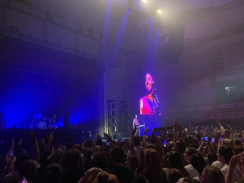 Matt Willis giving a cheeky smile to the crowd.
