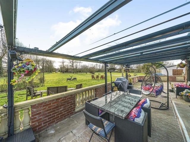 The walled seating patio has lovely surrounding scenery with visiting wildlife on occasion.