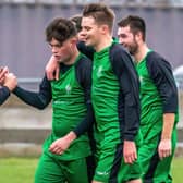 Adam Warrilow (second from left) is congratulated by his team-mates after scoring Fishburn Park's third goal  PHOTOS BY BRIAN MURFIELD