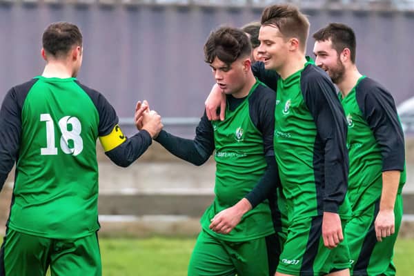 Adam Warrilow (second from left) is congratulated by his team-mates after scoring Fishburn Park's third goal  PHOTOS BY BRIAN MURFIELD