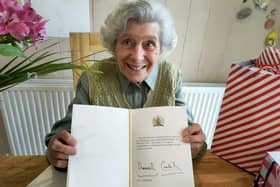 Joan Paylor with her 100th birthday card from King Charles III.
