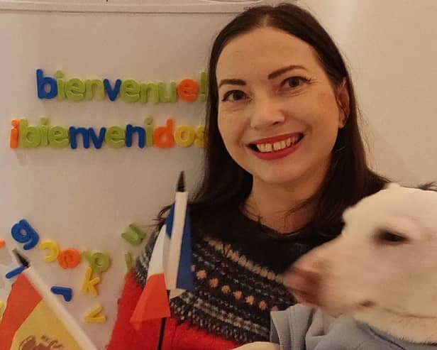 Alison and her dog Milo in her classroom in Scarborough 