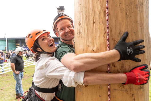 BBC Look North presenter Amy Garcia and weather presenter Paul Hudson ready to try pole climbing at the show