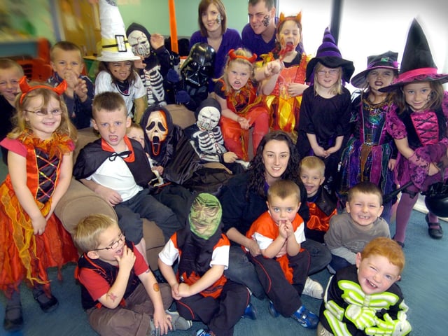 Out Of School Coordinator Jodene Dennis (centre) pictured with staff and children in Halloween dress. 084475 Photo by Kevin Allen.