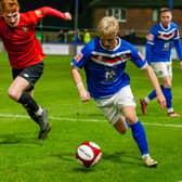 Max Howells has extended his loan at Whitby Town.